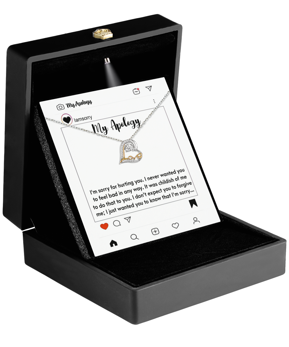 The Sorry-My Apology - Love Dancing Necklace includes a 14k gold heart pendant in a box with an Instagram print displaying an apology message.