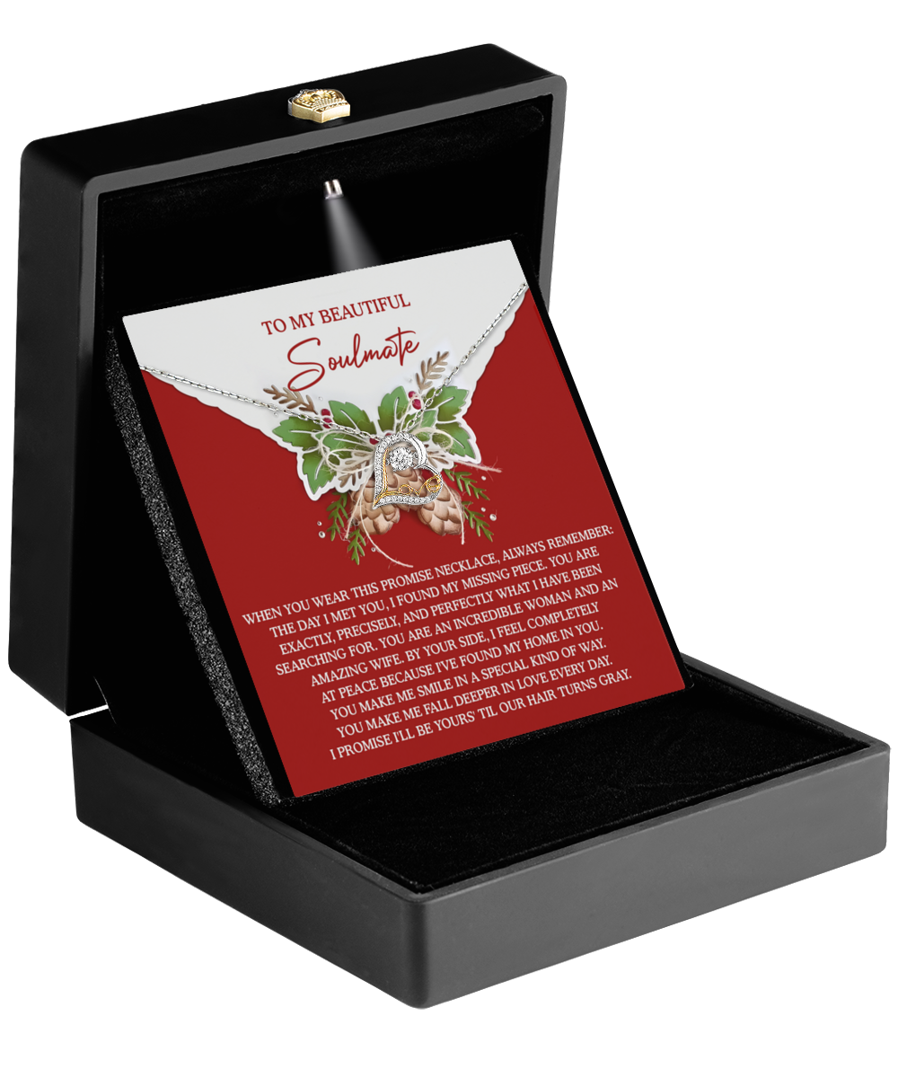 A black jewelry box is open, showcasing the exquisite Soulmate-At Peace - Love Dancing Necklace on a card featuring a heartfelt message for a soulmate against a red background. Crafted in sterling silver, the necklace adds an extra layer of elegance and sentiment.