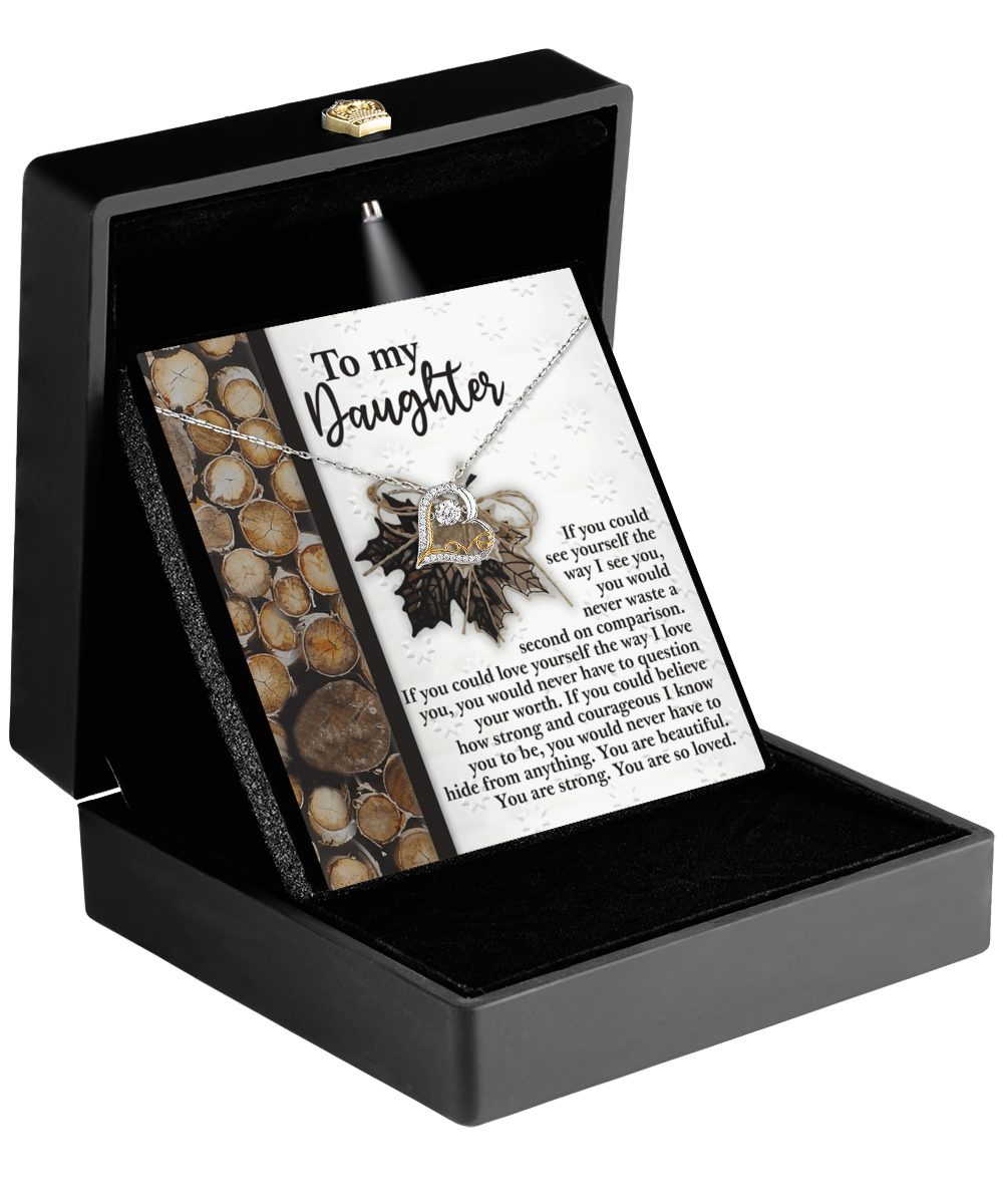 A black box with an open lid showcases a message card titled "To My Daughter" and the Daughter-Holds For You 2 - Love Dancing Necklace, which includes a .925 Sterling Silver chain adorned with a maple leaf pendant.