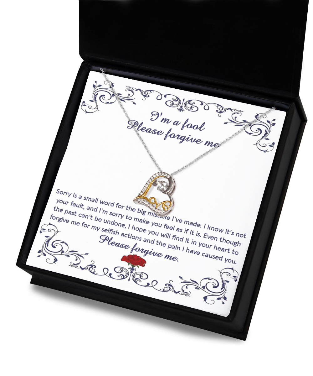 The "Sorry-I'm A Fool - Love Dancing Necklace" features a sterling silver chain with a heart-shaped pendant, elegantly presented in a box that includes an apology letter reading, "I'm a fool. Please forgive me," accompanied by an apologetic message and a rose illustration.