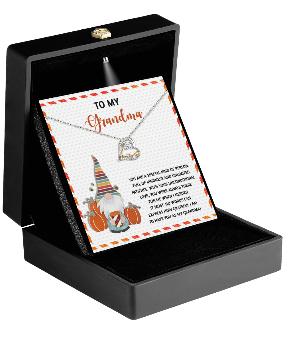 Presenting the Grandma-Needed It Most - Love Dancing Necklace, elegantly packaged in a black box. This beautiful necklace comes with a "To My Grandma" card adorned with a gnome, pumpkins, and a heartfelt message. Choose from exquisite 14k Gold or Sterling Silver options.