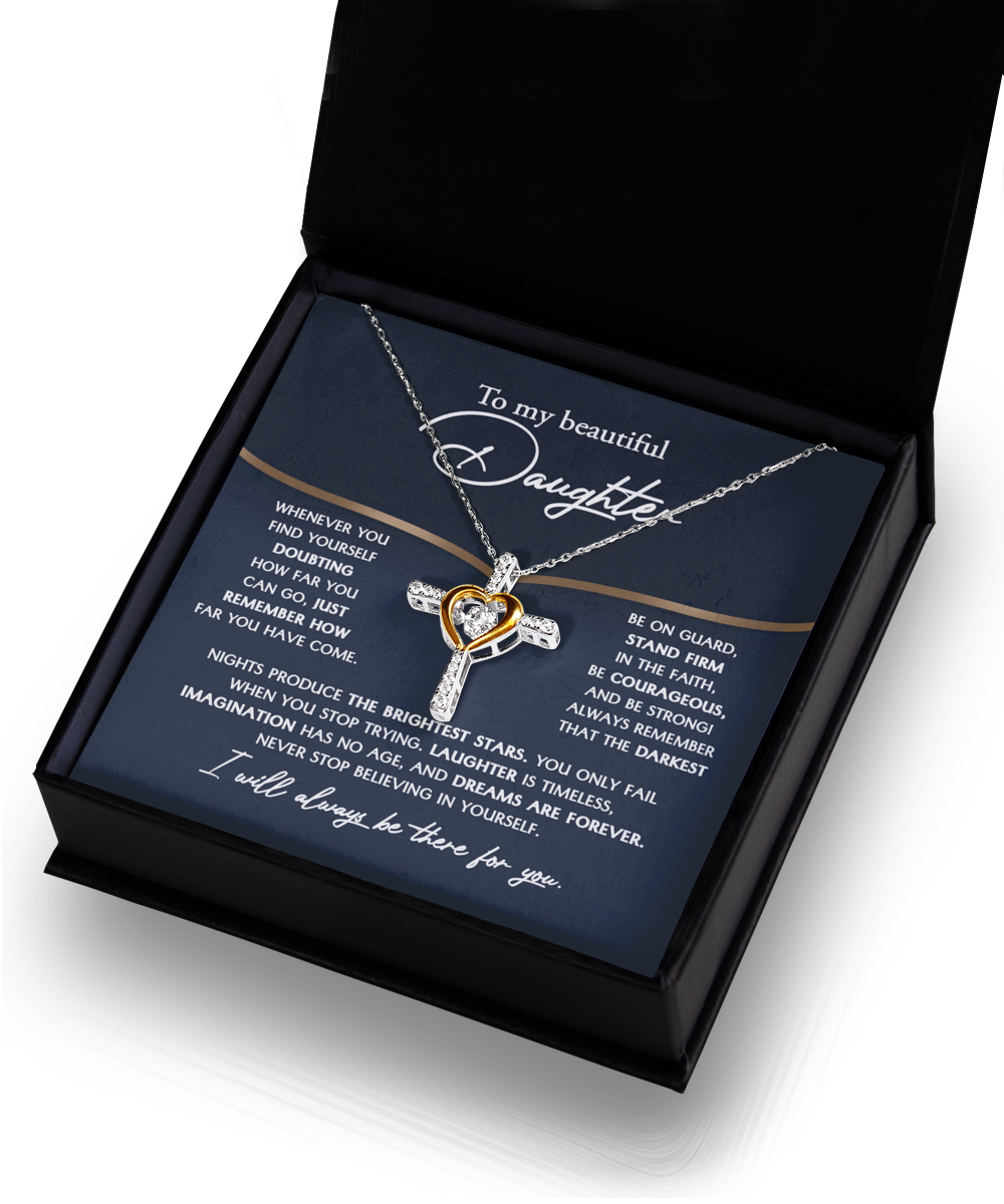 To Daughter-Brightest Stars - Cross Dancing Necklace: A sterling silver necklace featuring a heart pendant, elegantly presented on a rhodium-plated blue card with an inspirational message addressed to 'my beautiful daughter,' all inside a sophisticated black box.