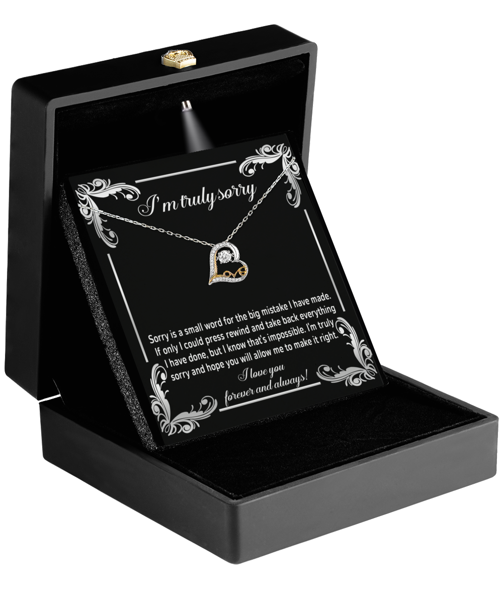 The Sorry-Make It Right - Love Dancing Necklace includes a black jewelry box that opens to reveal a 14k gold heart-shaped pendant alongside a heartfelt apology message.