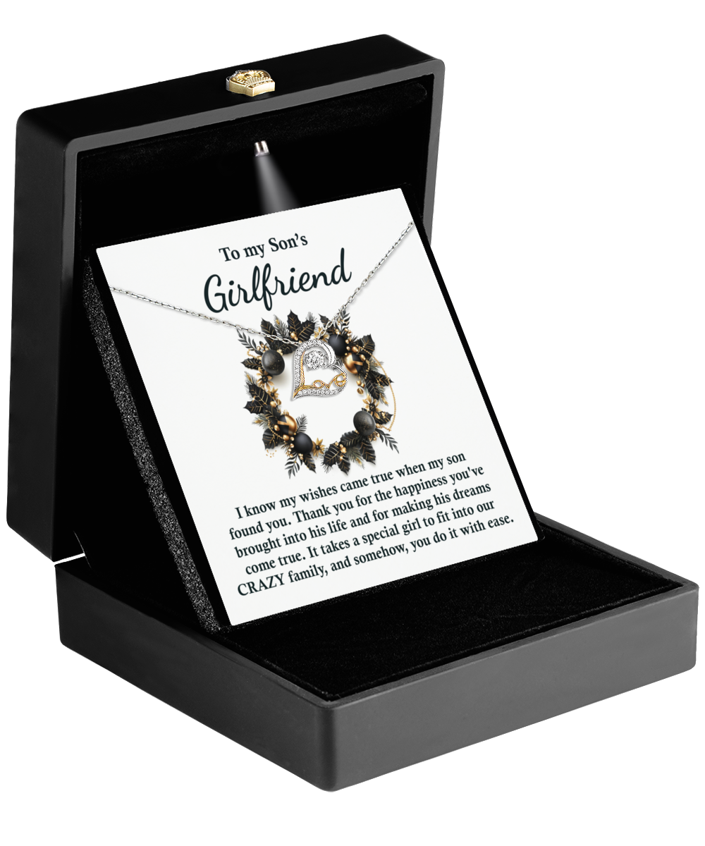 A "Son's Girlfriend - Found You - Love Dancing Necklace" crafted in 14k gold arrives in a box with a card addressed to "my son's girlfriend," expressing gratitude and warmly welcoming her into the family.