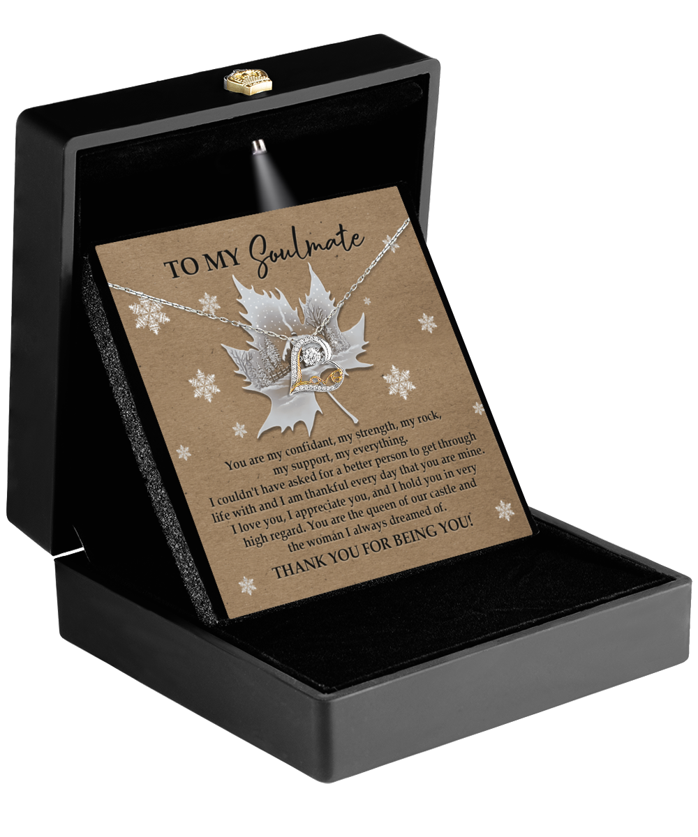 The Soulmate-Our Castle - Love Dancing Necklace showcases a delicate leaf pendant elegantly presented on a card inside a sophisticated black box, complete with a heartfelt message. Available in 14k gold or sterling silver, this necklace is the perfect gift to express your love with grace and elegance.