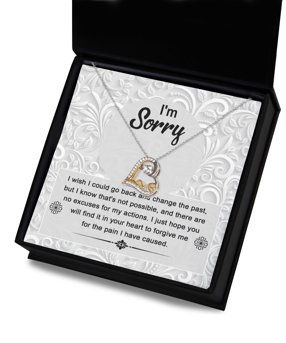 The Sorry-Change The Past - Love Dancing Necklace, a 14k gold piece with a heart-shaped pendant, is presented in a box with the heartfelt message: "I'm Sorry. I wish I could go back and change the past, but I know that's not possible... for the pain I have caused.