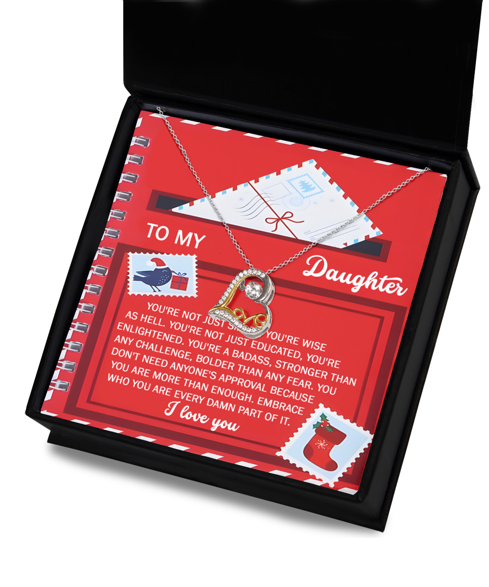 The "Daughter-Part Of It - Love Dancing Necklace," featuring a 14k gold heart pendant, sits on a red card inside a box with the message "To My Daughter." It conveys maternal love and concludes with "I love you.