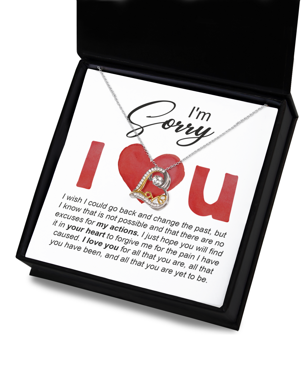 A "Sorry" note paired with the Sorry-Change The Past - Love Dancing Necklace, which features a .925 Sterling Silver heart pendant, is placed inside a box that contains an apology message.