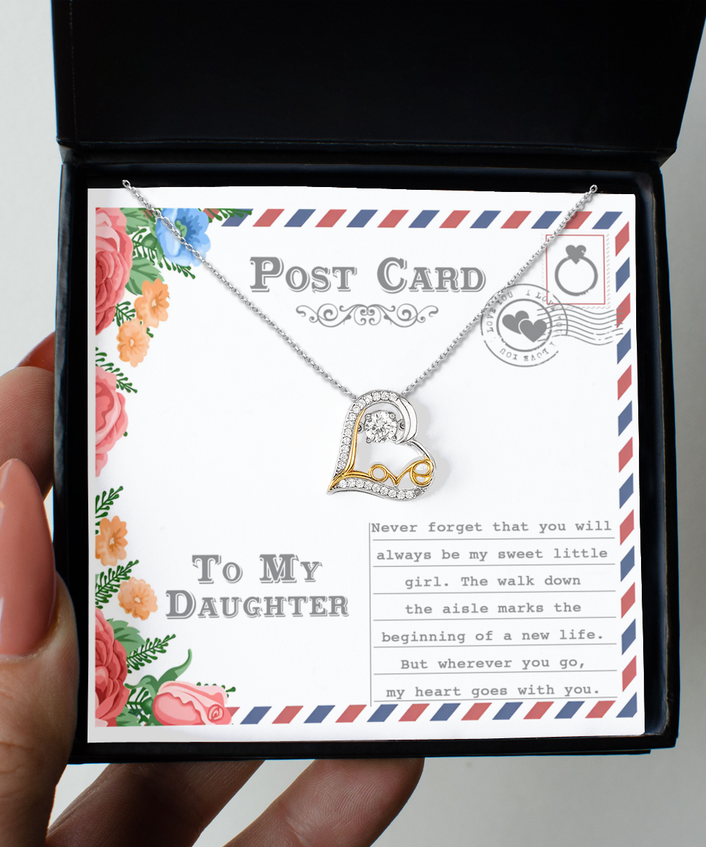 The "To Daughter-Goes With You - Love Dancing Necklace" is a Sterling Silver piece featuring a heart pendant, presented in a gift box inscribed with "To My Daughter." The background evokes the charm of a postcard, adorned with floral designs and heartfelt sentimental text.