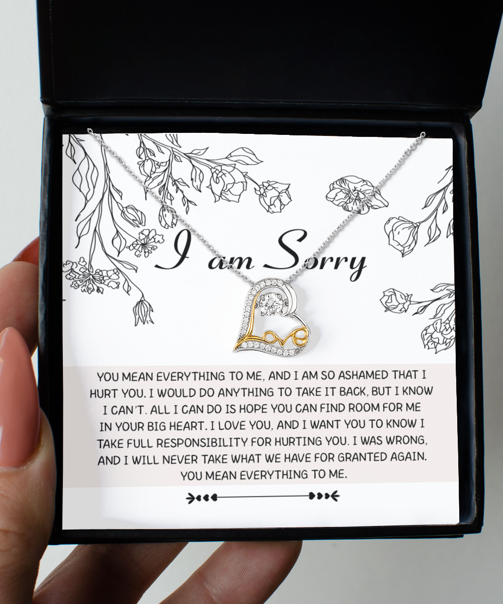 The "Sorry-Your Big Heart - Love Dancing Necklace" is a sterling silver necklace featuring a heart-shaped pendant, beautifully packaged in a box that includes a heartfelt note with an apology and expressions of love.