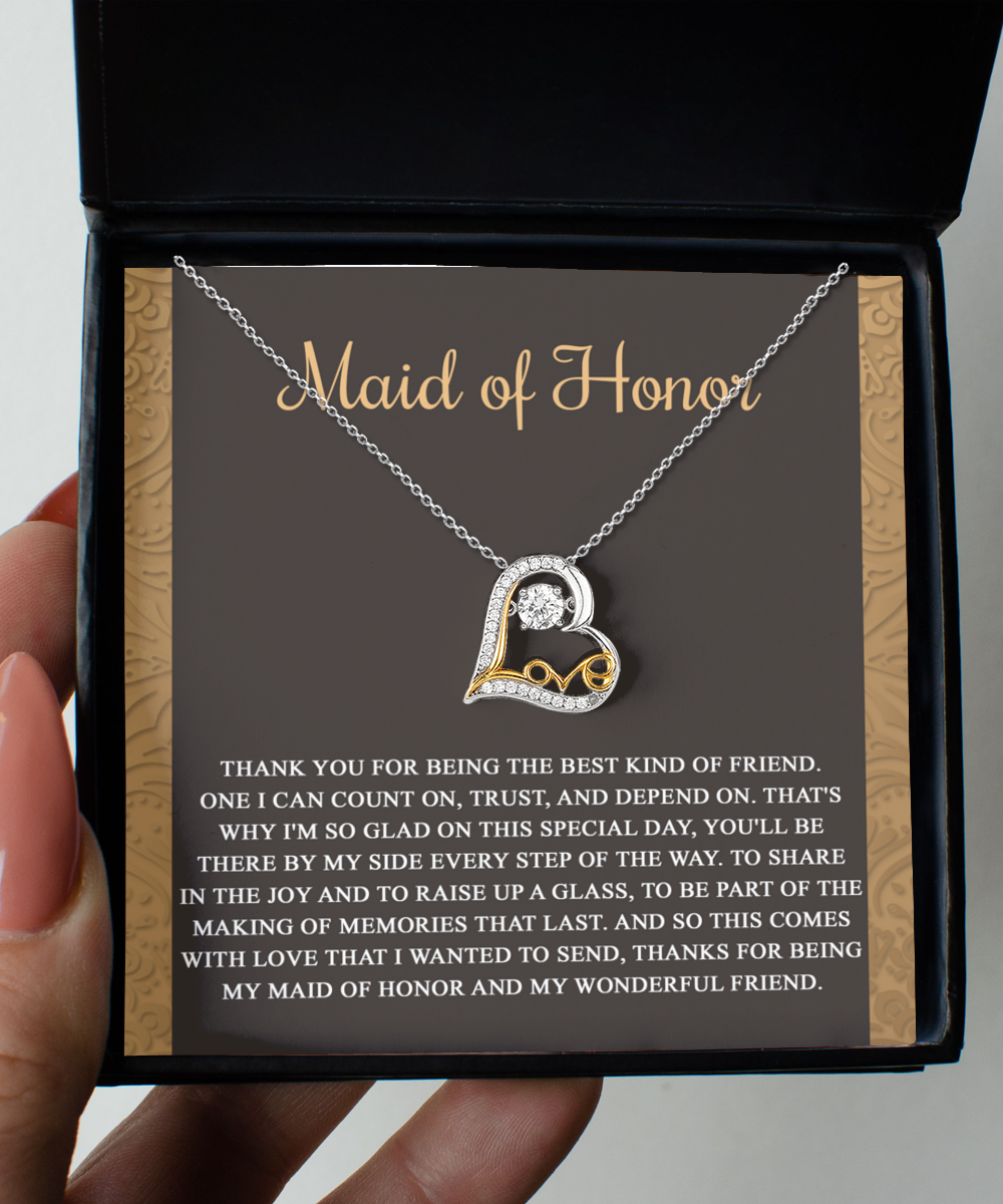 A stunning Sterling Silver "To Maid of Honor-Kind Of Friend - Love Dancing Necklace" displayed in a box with a heartfelt message. The message, titled "Maid of Honor," expresses gratitude for the friendship, support, and memories shared with the maid of honor.