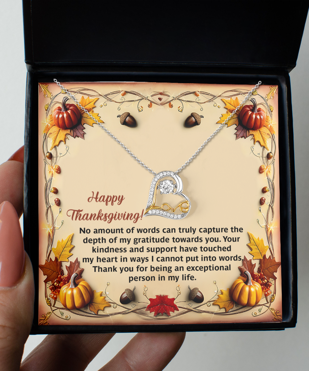 The Thanksgiving-Put Into Words - Love Dancing Necklace, presented in a box with pumpkins and leaves, showcases a sterling silver necklace adorned with a heart-shaped pendant sparkling with cubic zirconia. The accompanying text conveys gratitude and appreciation for an exceptional person.