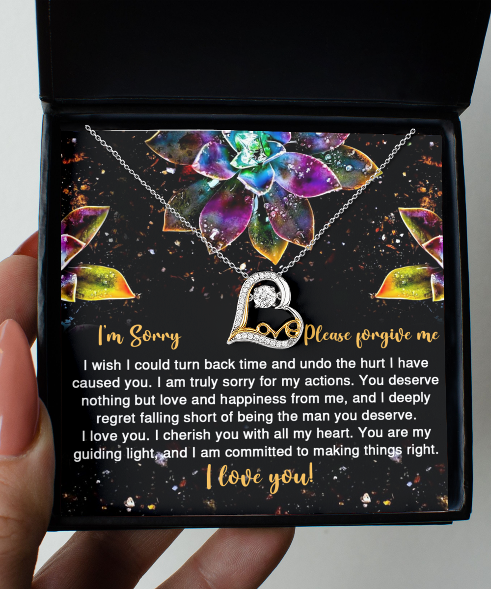 The Sorry-All My Heart - Love Dancing Necklace is a 14k gold necklace presented in a box accompanied by a heartfelt apology message. The message conveys regret for causing hurt and expresses a deep commitment to love and happiness, ending with "I love you!" and a request for forgiveness.