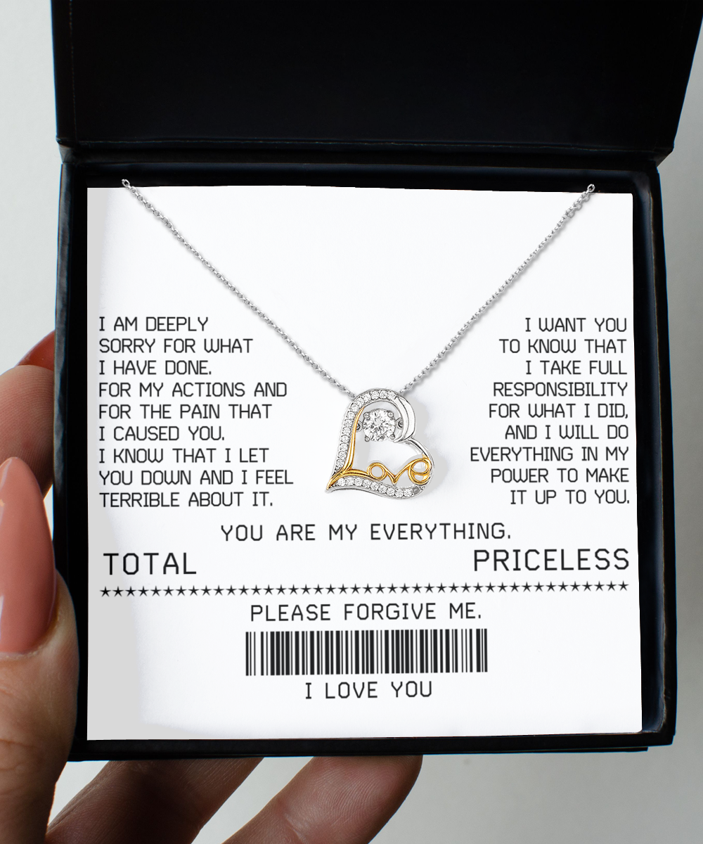 A Sorry-Make It Up - Love Dancing Necklace features an interlocking heart pendant on a white card with an apology message and phrases such as "YOU ARE MY EVERYTHING" and "PLEASE FORGIVE ME" printed in black text.