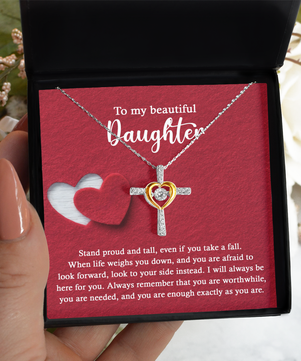 An open black box reveals the stunning "To Daughter-As You Are - Cross Dancing Necklace," featuring a heart intertwined with a cross in 14k gold. The box also includes an inspirational message addressed to a daughter.