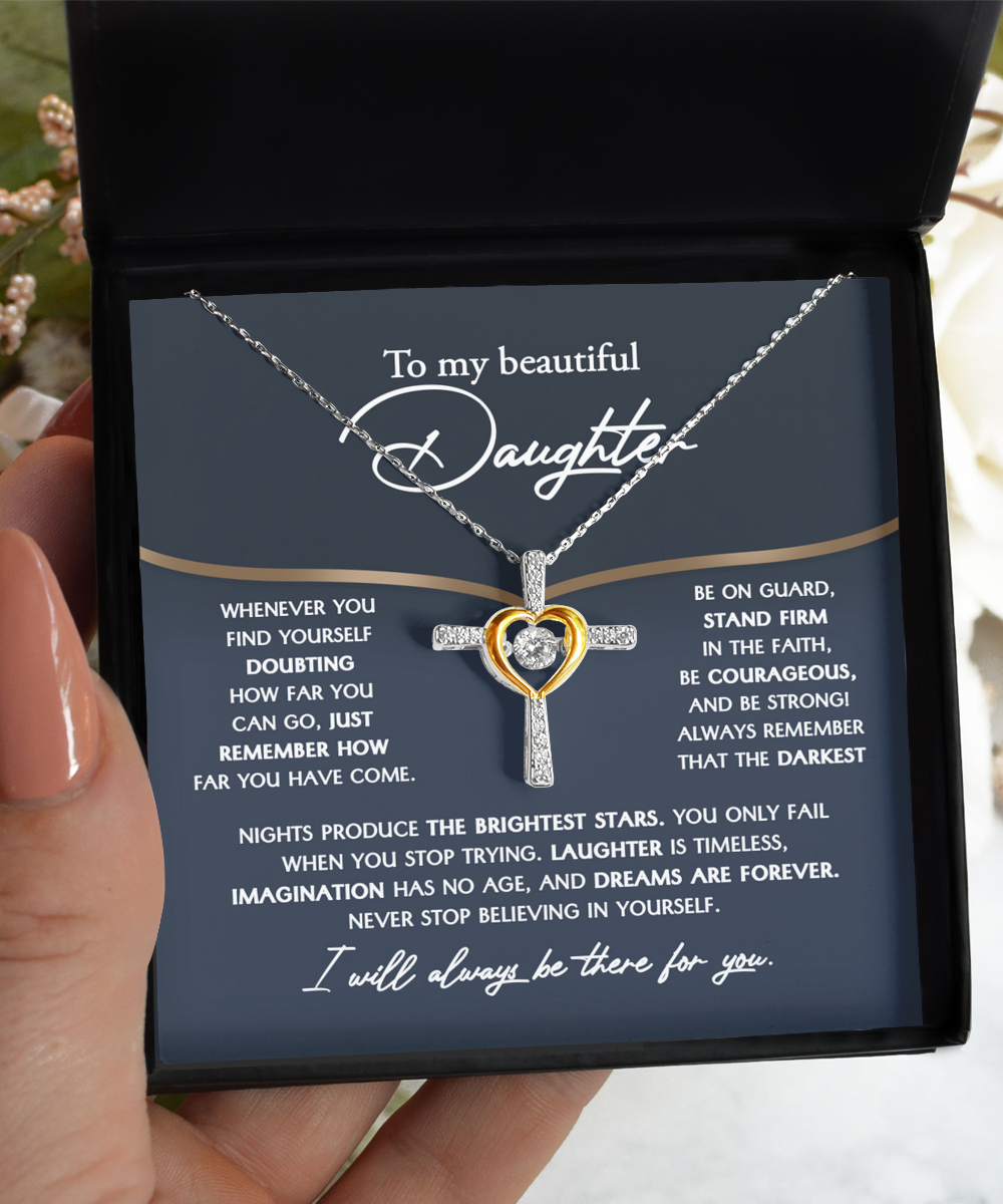 To Daughter-Brightest Stars - Cross Dancing Necklace: A sterling silver necklace featuring a heart pendant, elegantly presented on a rhodium-plated blue card with an inspirational message addressed to 'my beautiful daughter,' all inside a sophisticated black box.