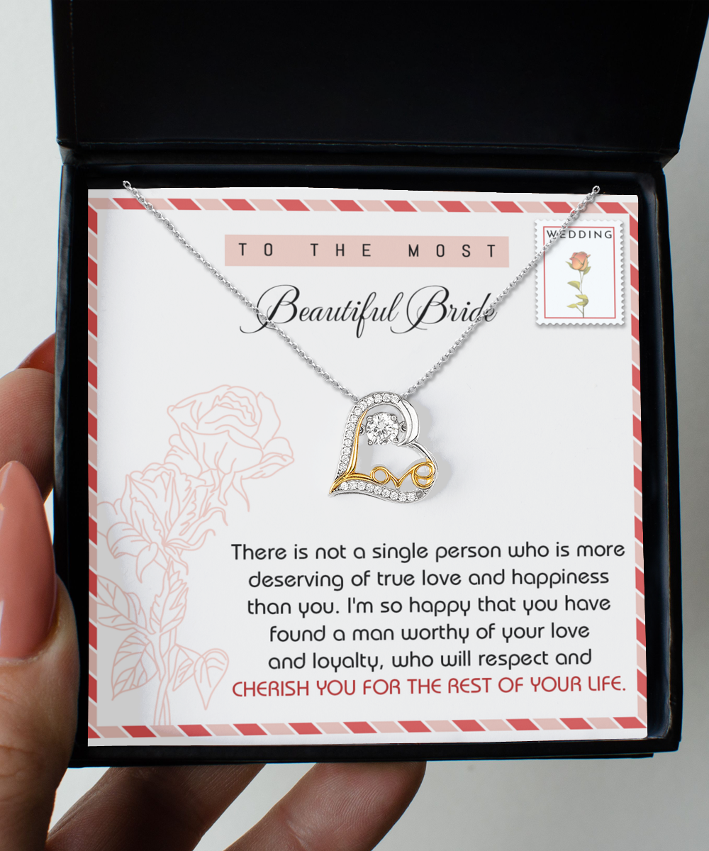 A Bride-Of Your Life - Love Dancing Necklace is displayed in an open black box. The sterling silver hypoallergenic necklace features text addressed to a bride, expressing love and congratulations.