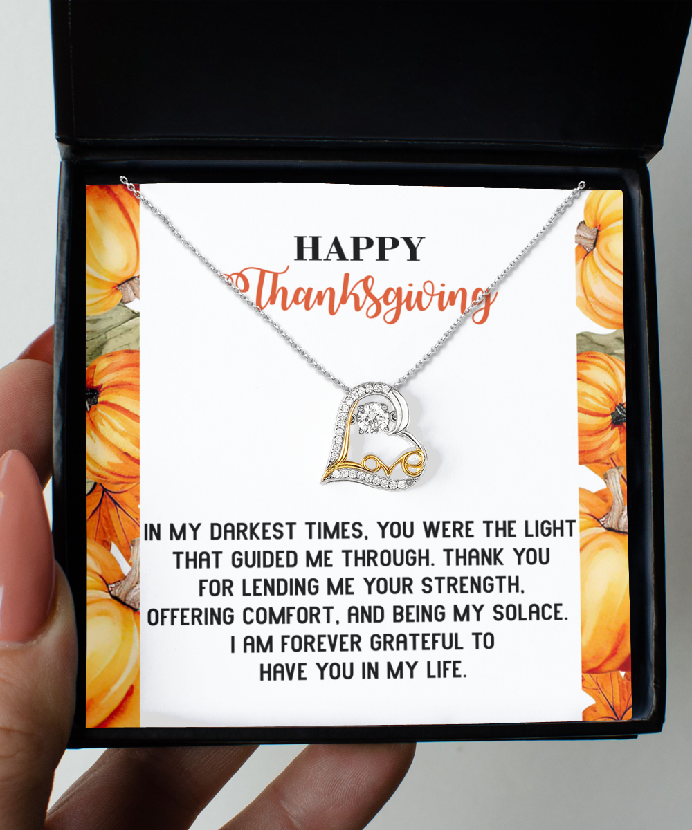 The Thanksgiving-Guided Me Through - Love Dancing Necklace showcases a sterling silver heart necklace adorned with a letter "L" pendant, elegantly presented in a box with a Thanksgiving-themed message celebrating gratitude and support.