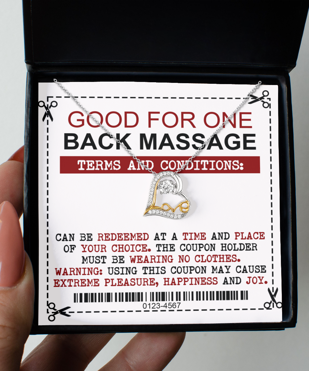 A coupon encased in a black box offers one Wife-Back Massage with specific terms, including the need for the coupon holder to be without clothes and noting the potential for extreme pleasure and joy. Perfectly pairs with our Love Dancing Necklace.