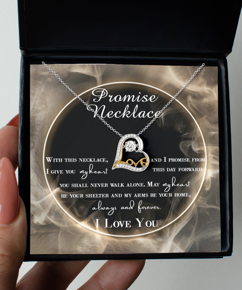 A To Wife, Promise Necklace - Love Dancing Necklace featuring a heart-shaped pendant with a diamond in the center is displayed inside a black box with a heartfelt promise message.