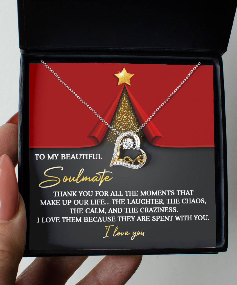 The "Soulmate-The Moments - Love Dancing Necklace," crafted in sterling silver with a heart-shaped pendant, elegantly rests in its box, complemented by a heartfelt message of love and appreciation for your soulmate.