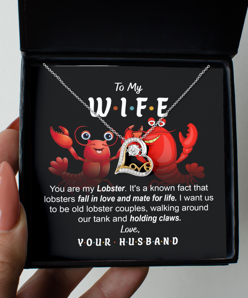 A box with a lobster-themed necklace crafted in .925 Sterling Silver and a message that reads: "To My W.I.F.E. You are my Lobster. Love, Your Husband." The background shows cartoon lobsters contains the Wife-Old Lobster Couples - Love Dancing Necklace.