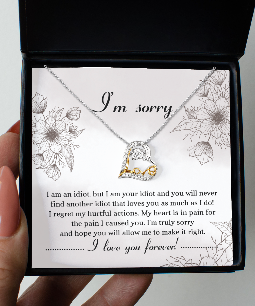 The Sorry-For The Pain - Love Dancing Necklace, a heart-shaped, 14k gold-plated piece, comes with a heartfelt apology note expressing deep regret for causing pain and pleading for forgiveness. The message concludes with "I love you forever.