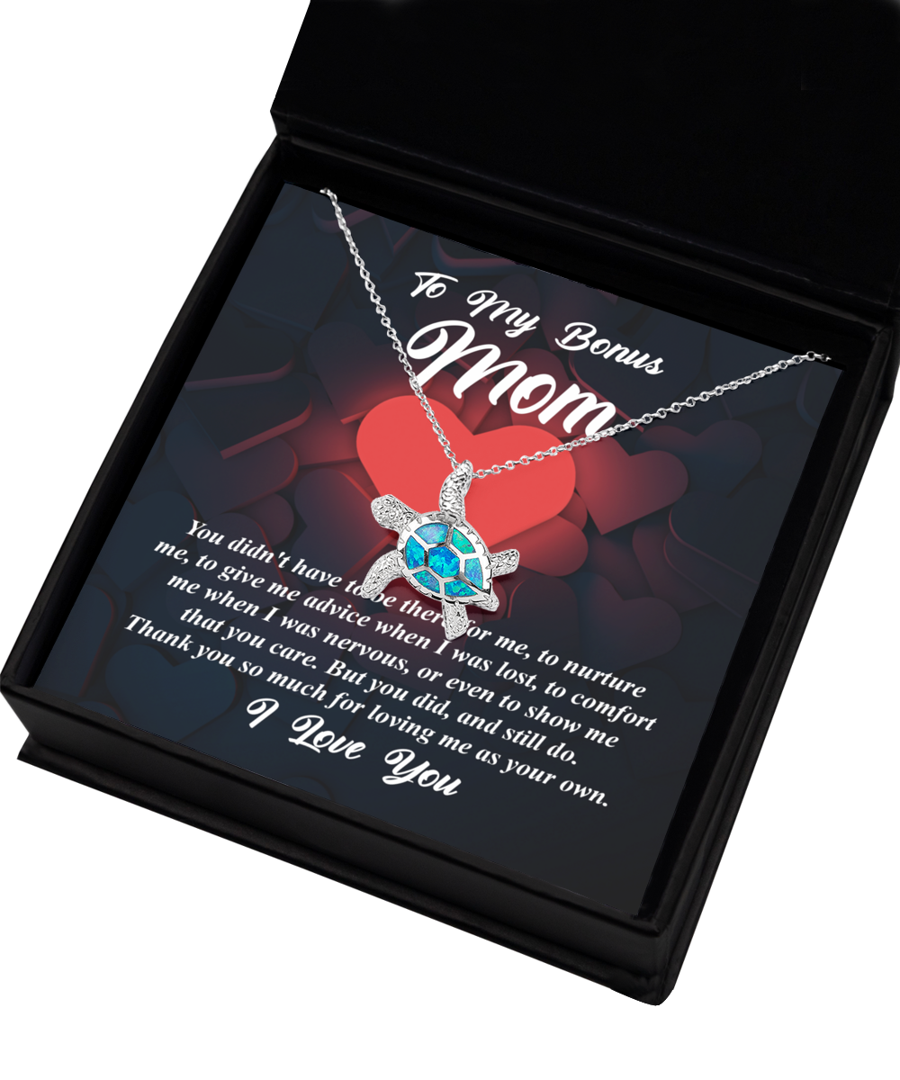 A Gearbubble Opal Turtle Necklace in a gift box with a message to a "bonus mom" expressing gratitude and love, serving as a symbol of love.