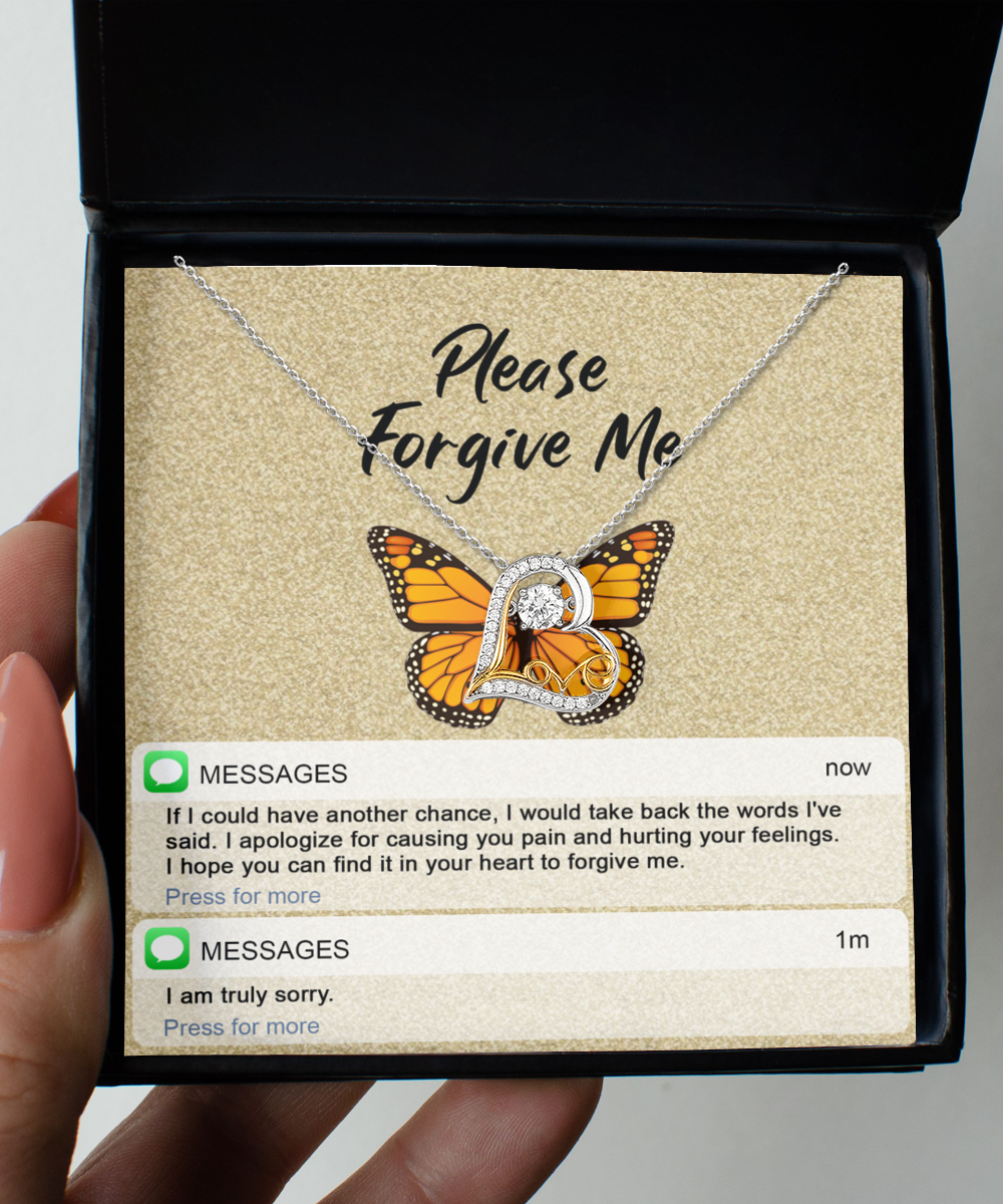 A Sterling Silver necklace named "Sorry-In Your Heart - Love Dancing Necklace" with a butterfly pendant sits inside a box with "Please Forgive Me" written above. Below are text messages saying, "I apologize for causing you pain," and, "I am truly sorry.