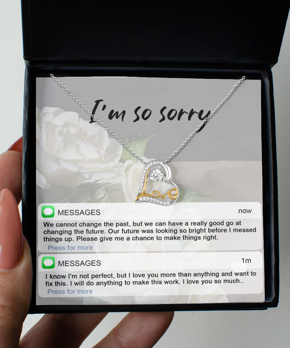 A Sorry-I'm Not Perfect - Love Dancing Necklace featuring a heart-shaped pendant on a .925 sterling silver chain rests inside a box inscribed with "I'm so sorry." Below are phone messages expressing regret and hopes of mending the relationship, each word sparkling like AAAA Cubic Zirconia.