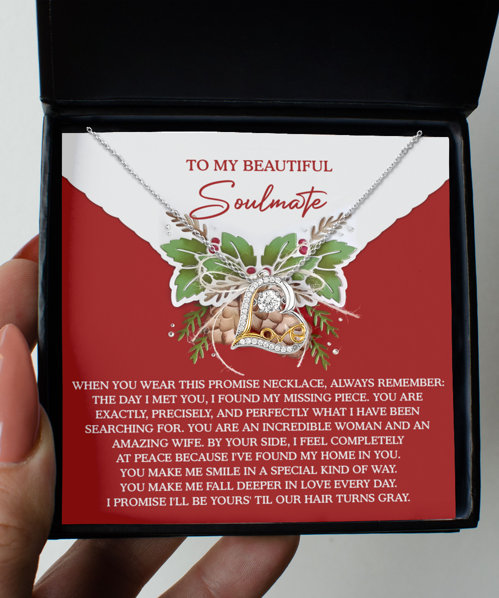 The Soulmate-At Peace - Love Dancing Necklace, crafted from sterling silver, is presented in a box with a heartfelt message about love and companionship printed inside the lid.