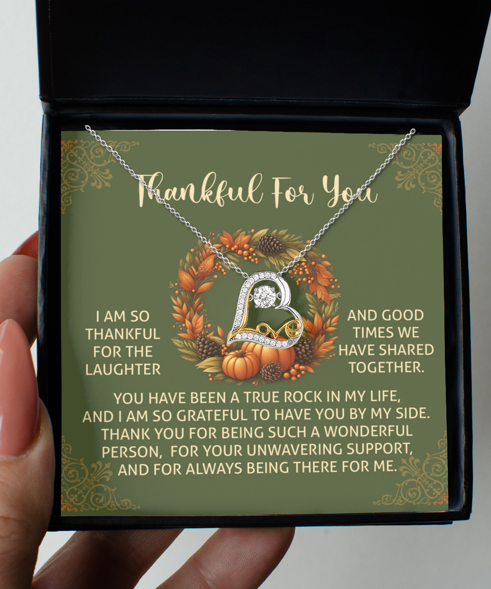 The Thanksgiving-By My Side - Love Dancing Necklace is packaged in a black box accompanied by a green card. The card displays the message "Thankful For You" with autumnal decorations, conveying a heartfelt expression of gratitude.