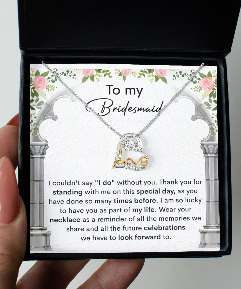 A bridesmaid thank you card adorned with floral designs, featuring the Bridesmaid-Standing With Me - Love Dancing Necklace. The card expresses gratitude for the bridesmaid's support and looks forward to future celebrations.