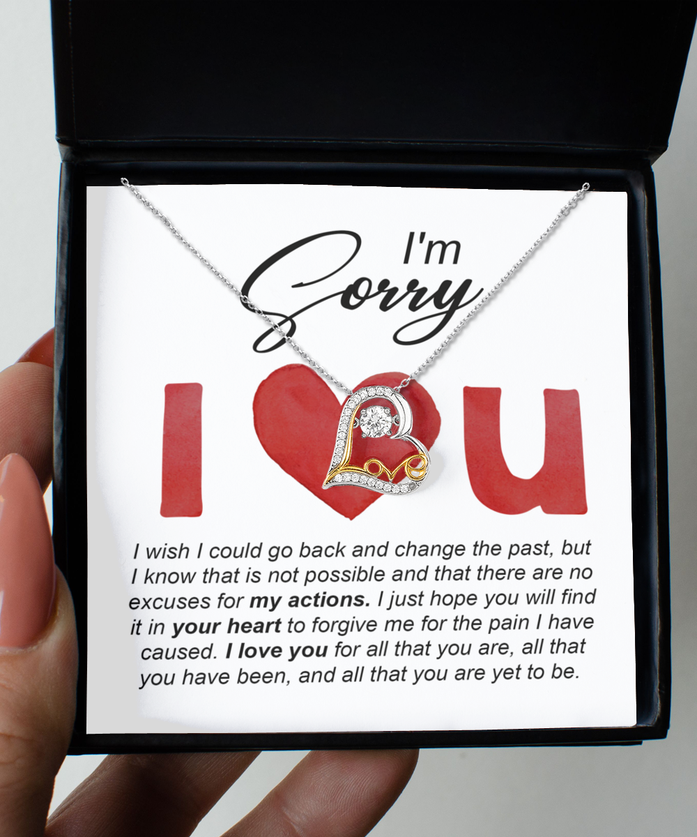 A "Sorry" note paired with the Sorry-Change The Past - Love Dancing Necklace, which features a .925 Sterling Silver heart pendant, is placed inside a box that contains an apology message.