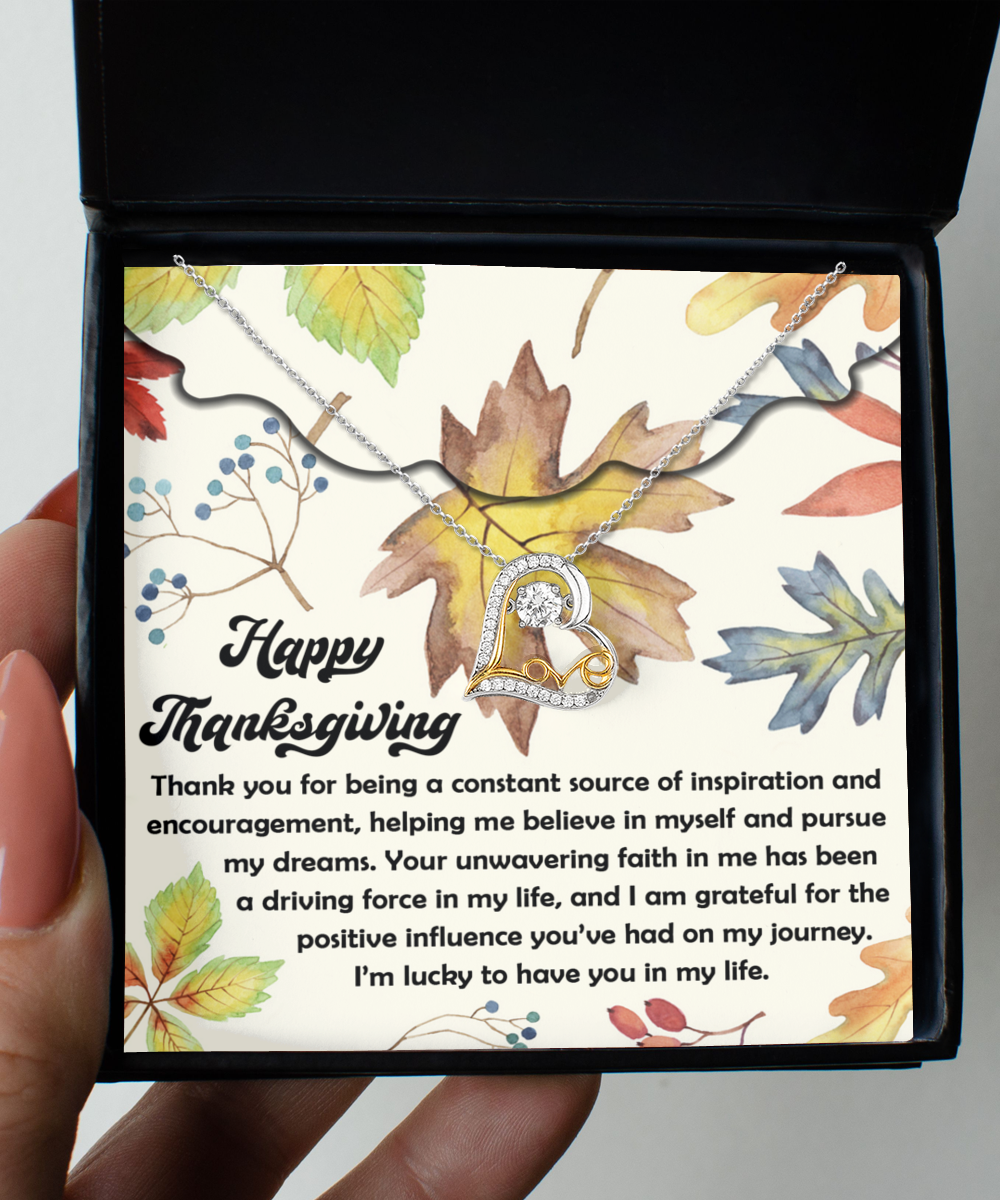 The Thanksgiving-On My Journey - Love Dancing Necklace, made of sterling silver and featuring a heart pendant, is beautifully presented in a box decorated with autumn leaf illustrations and a heartfelt Thanksgiving message.