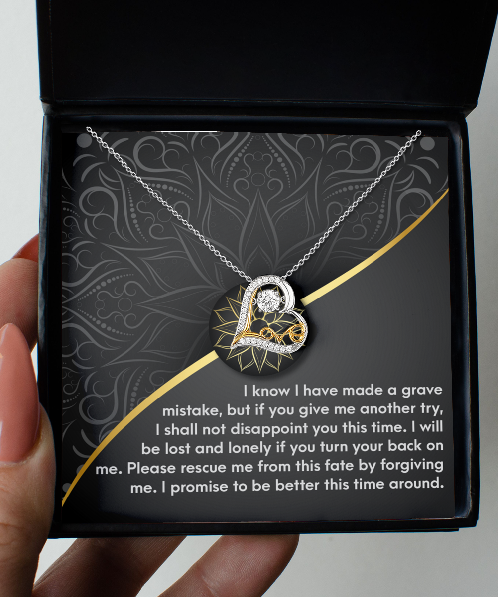 Introducing the "Sorry-Turn Your Back - Love Dancing Necklace," a heart-shaped pendant necklace crafted in .925 Sterling Silver, featuring a heartfelt message about seeking forgiveness. This elegant piece is beautifully packaged in a sophisticated black box adorned with gold accents.