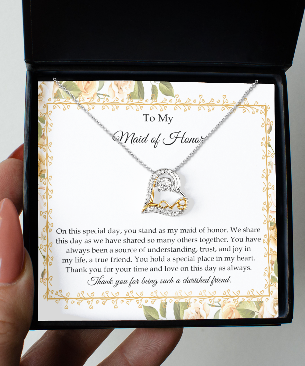 The "To Wife, Be As One - Love Dancing Necklace," a heart-shaped .925 Sterling Silver piece adorned with AAAA Cubic Zirconia, comes nestled inside a gift box. It includes a heartfelt note that conveys gratitude, appreciation, and love to the Maid of Honor, highlighting the significance of their friendship.
