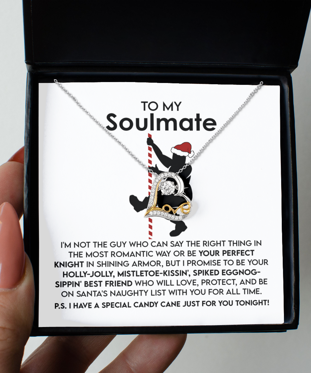 The Soulmate-For All Time - Love Dancing Necklace, created in 14k gold, includes a heart-shaped pendant alongside a message card inside a box. The card showcases a silhouette of a couple embracing, embellished with decorative hearts and an inspiring message about being a supportive partner.