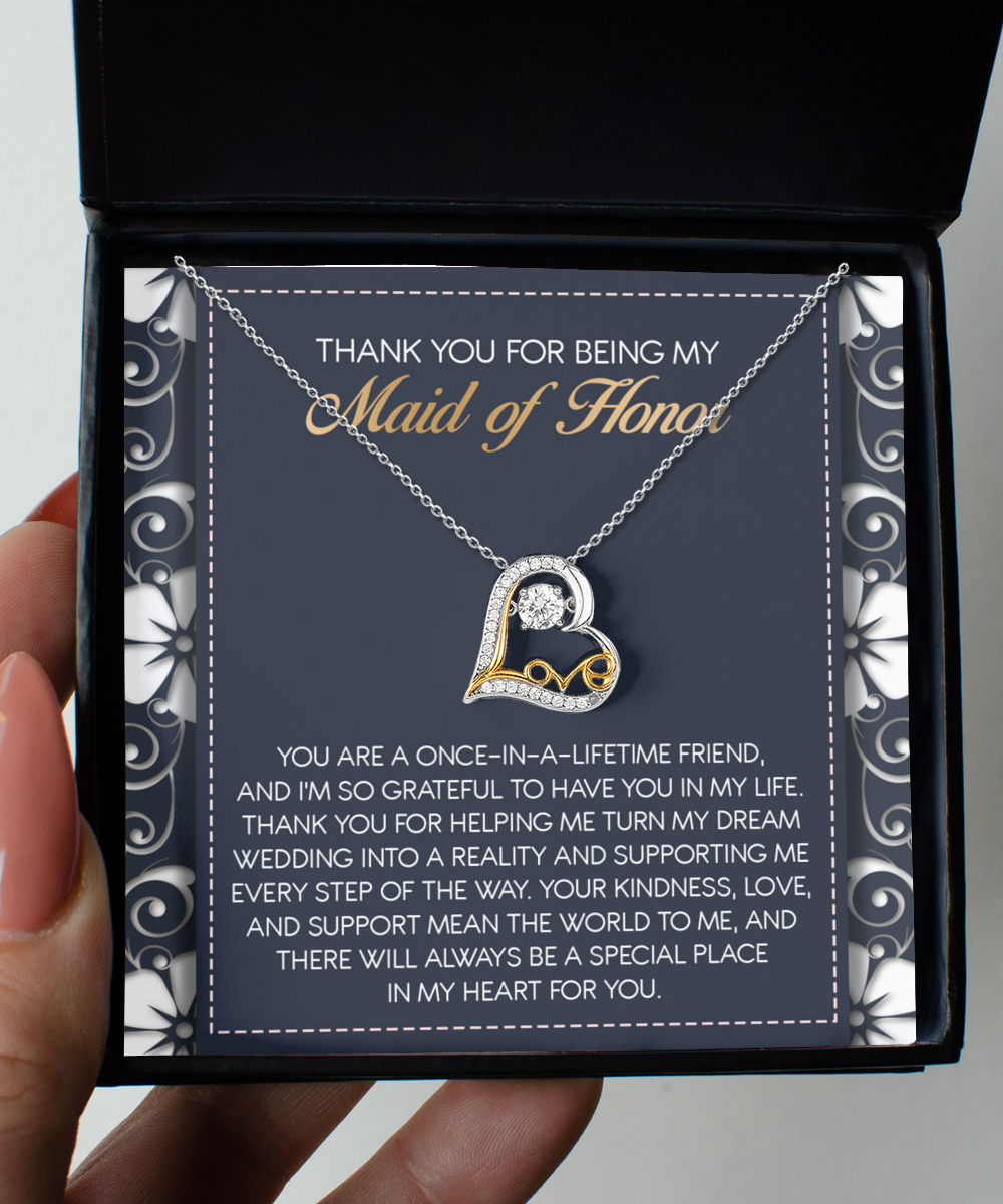 The "To Maid of Honor-World To Me - Love Dancing Necklace," a sterling silver heart-shaped pendant, sits in a black box above a message expressing gratitude to the Maid of Honor.