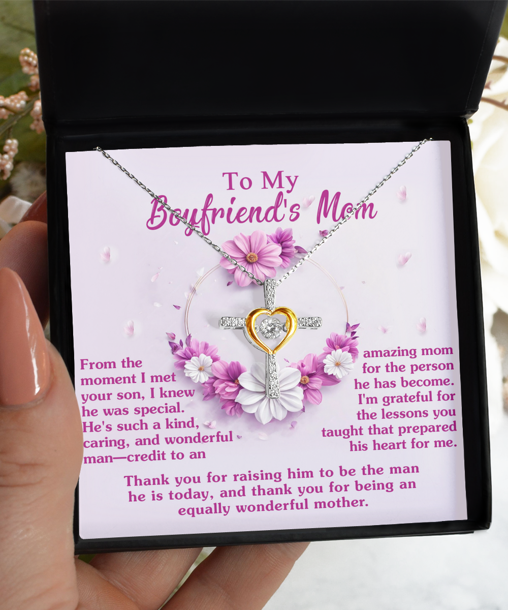 A pendant necklace with a heartfelt message displayed for a boyfriend's mother, expressing gratitude and admiration. This Gearbubble To Boyfriend's Mom, Wonderful Mother - Cross Dancing Necklace symbolizes the timeless beauty of a mother's love.