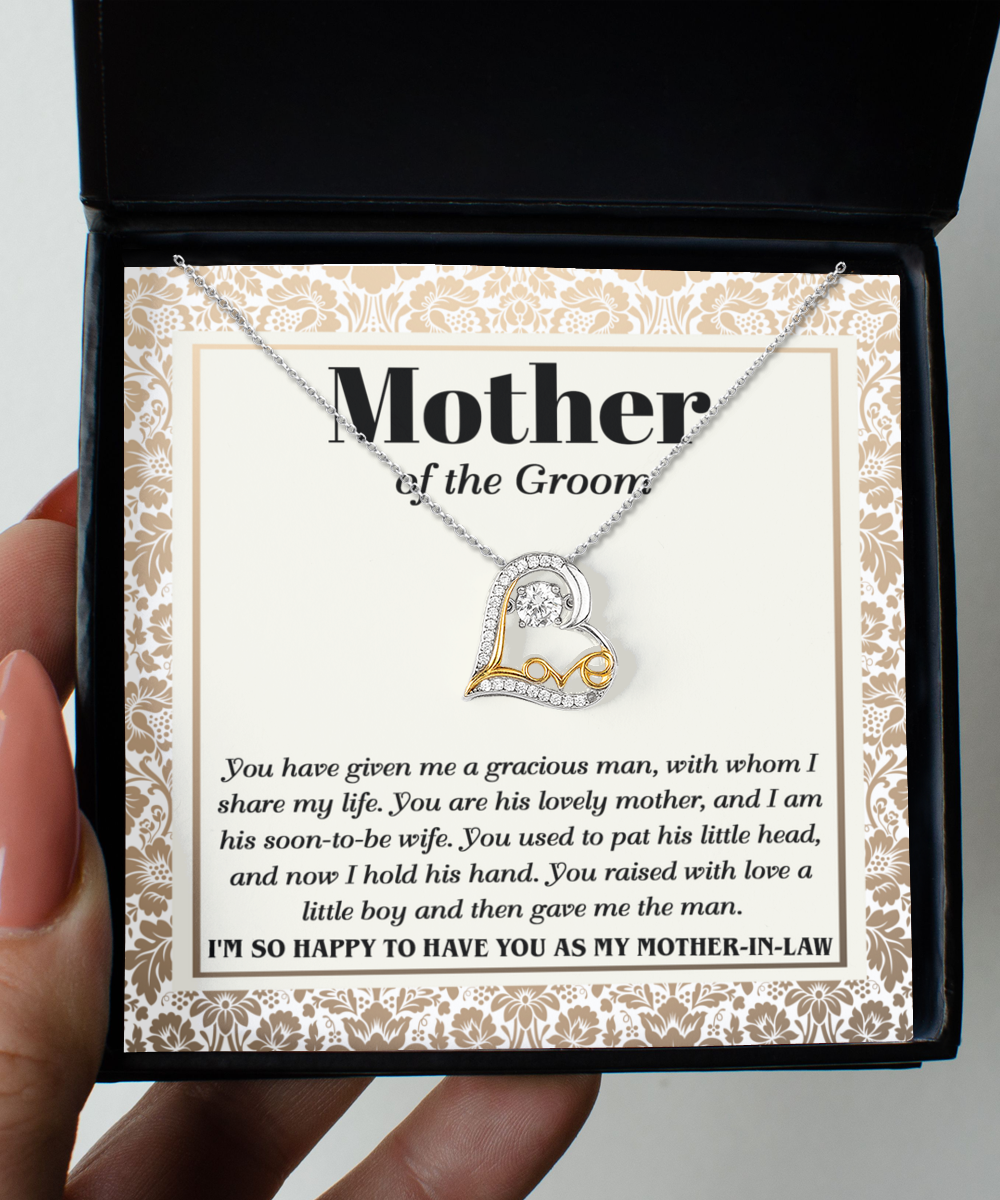 A Mother-In-Law-To Have You - Love Dancing Necklace with a heart-shaped pendant, crafted in sterling silver, is displayed in a box that includes a heartfelt message addressed to the mother of the groom, expressing gratitude and admiration.