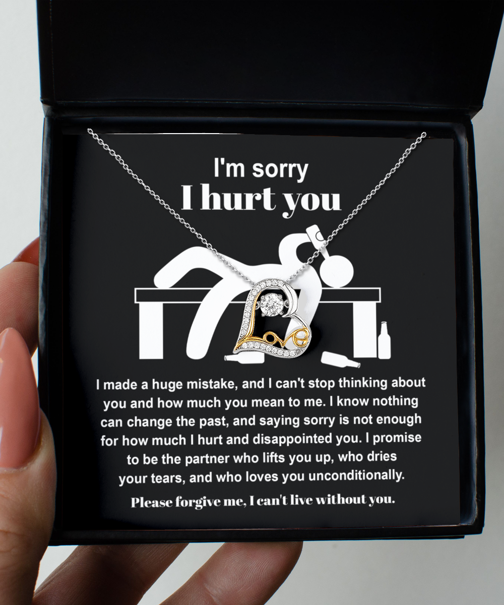 The Sorry-Change The Past 2 - Love Dancing Necklace with a heartfelt message reads: "I'm sorry I hurt you. I made a huge mistake. Please forgive me, I can't live without you." The sterling silver necklace features a pendant of a figure holding a heart.