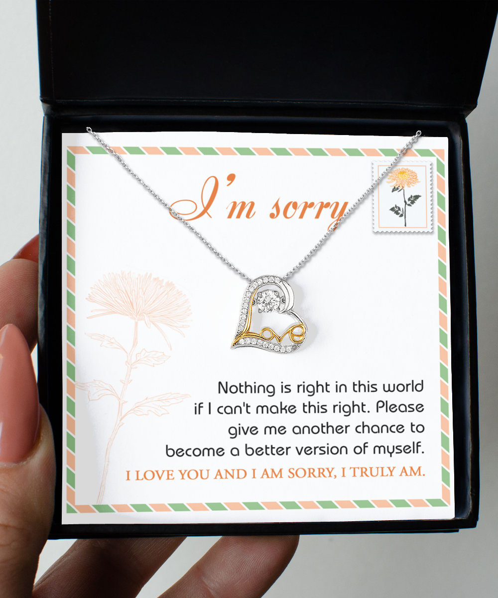 The Sorry-Another Chance - Love Dancing Necklace, featuring a heart pendant and crafted from .925 Sterling Silver, is displayed in a box that includes an apology and a heartfelt request for another chance to make things right.