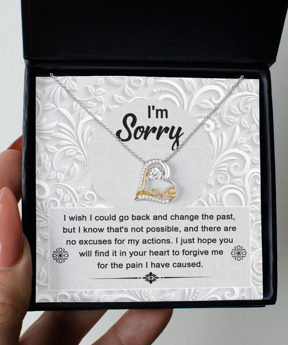 The Sorry-Change The Past - Love Dancing Necklace, a 14k gold piece with a heart-shaped pendant, is presented in a box with the heartfelt message: "I'm Sorry. I wish I could go back and change the past, but I know that's not possible... for the pain I have caused.