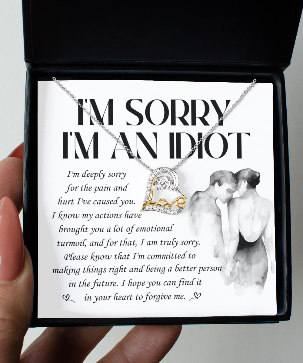 The "Sorry-Emotional Turmoil - Love Dancing Necklace," a .925 Sterling Silver necklace featuring a heart-shaped pendant, is showcased above a note that reads, "I'm Sorry I'm An Idiot," alongside an apology message expressing regret and seeking forgiveness.