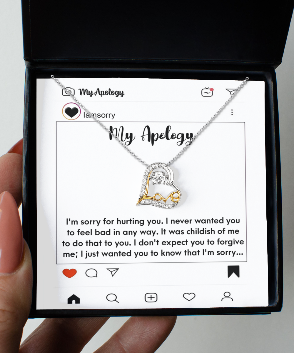 A Sorry-My Apology - Love Dancing Necklace, featuring a silver and gold .925 Sterling Silver pendant, is beautifully set on an Instagram-themed card with a heartfelt apology message. The entire presentation comes in a black gift box with "My Apology" elegantly inscribed on the card.