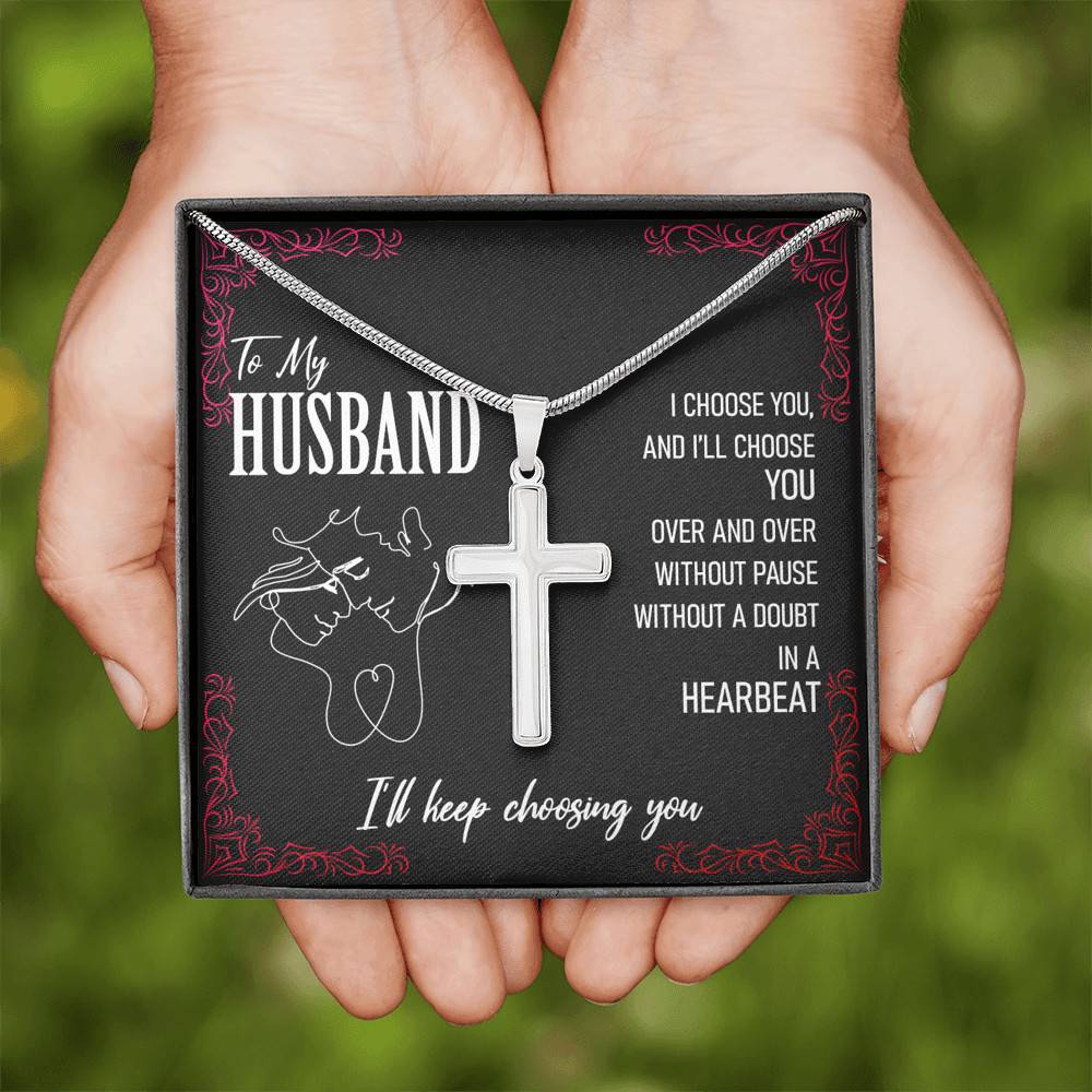 A slingly necklace with the brand name "To My Husband, I'll Keep Choosing Youw" and a cross on it, that says to my husband.