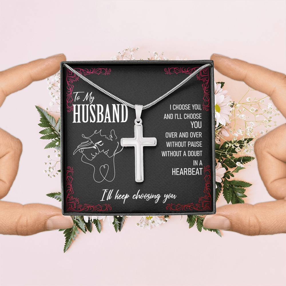 Hands holding a To My Husband, I'll Keep Choosing You necklace with a cross in it. Guaranteed safe checkout by slingly.