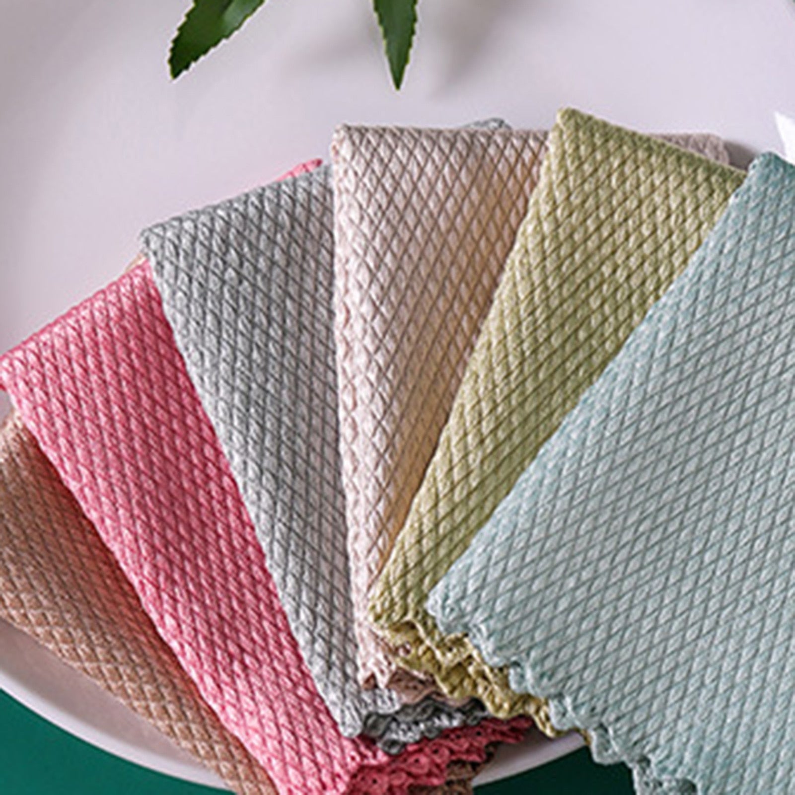 Five Fish Scale Nano Reusable Cleaning Cloths from MezoJaoie Wonder Lifestyle Store on a white plate.
