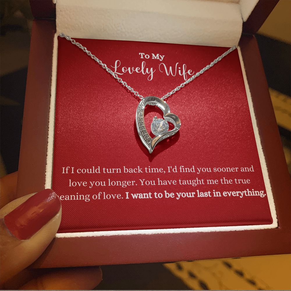 A woman is holding the "I Want To Be Your Last In Everything Forever Love Necklace - To Wife from Husband" by ShineOn Fulfillment in a box.